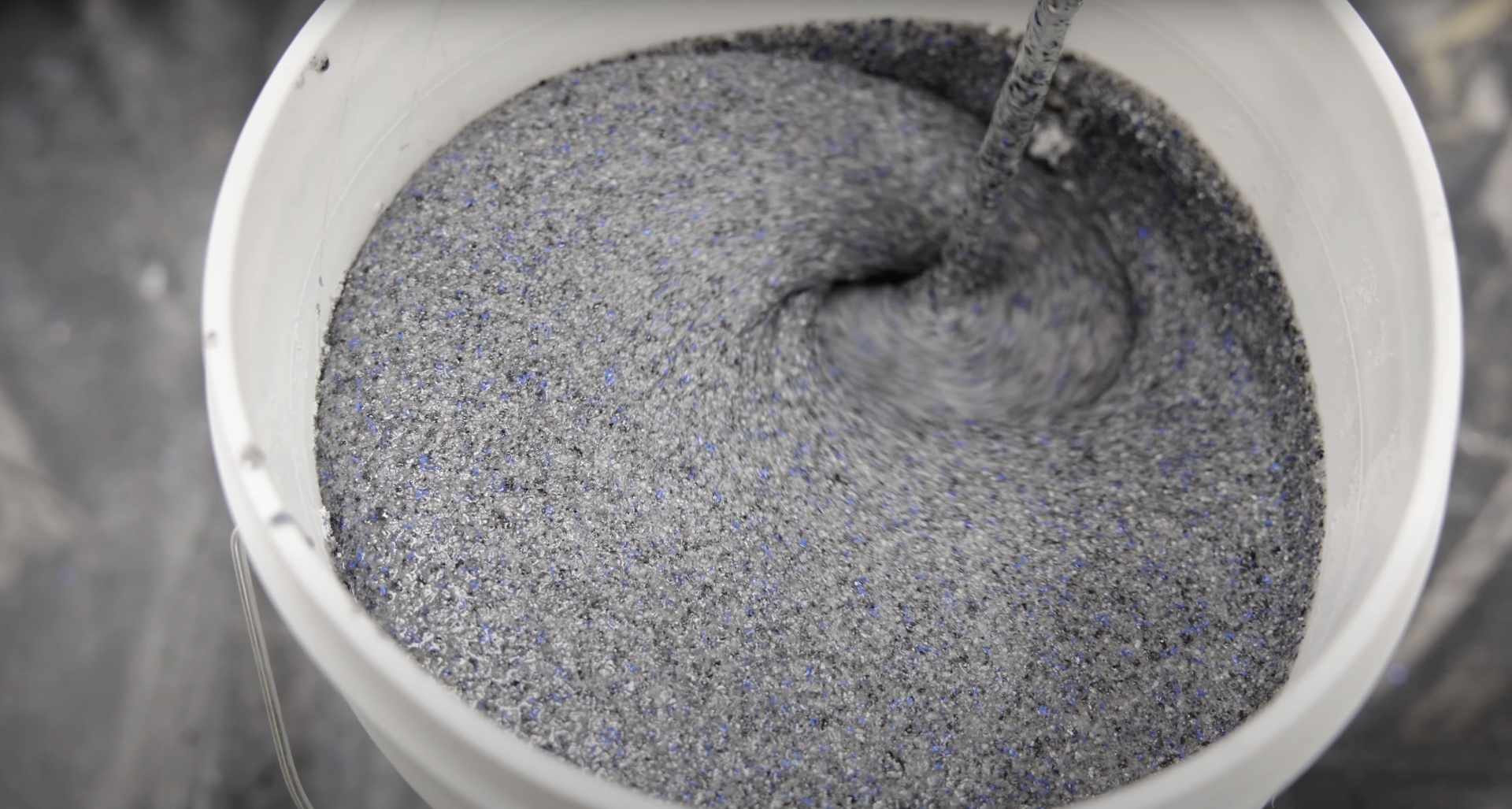 Close-up view of fresh concrete mix showing proper consistency and texture