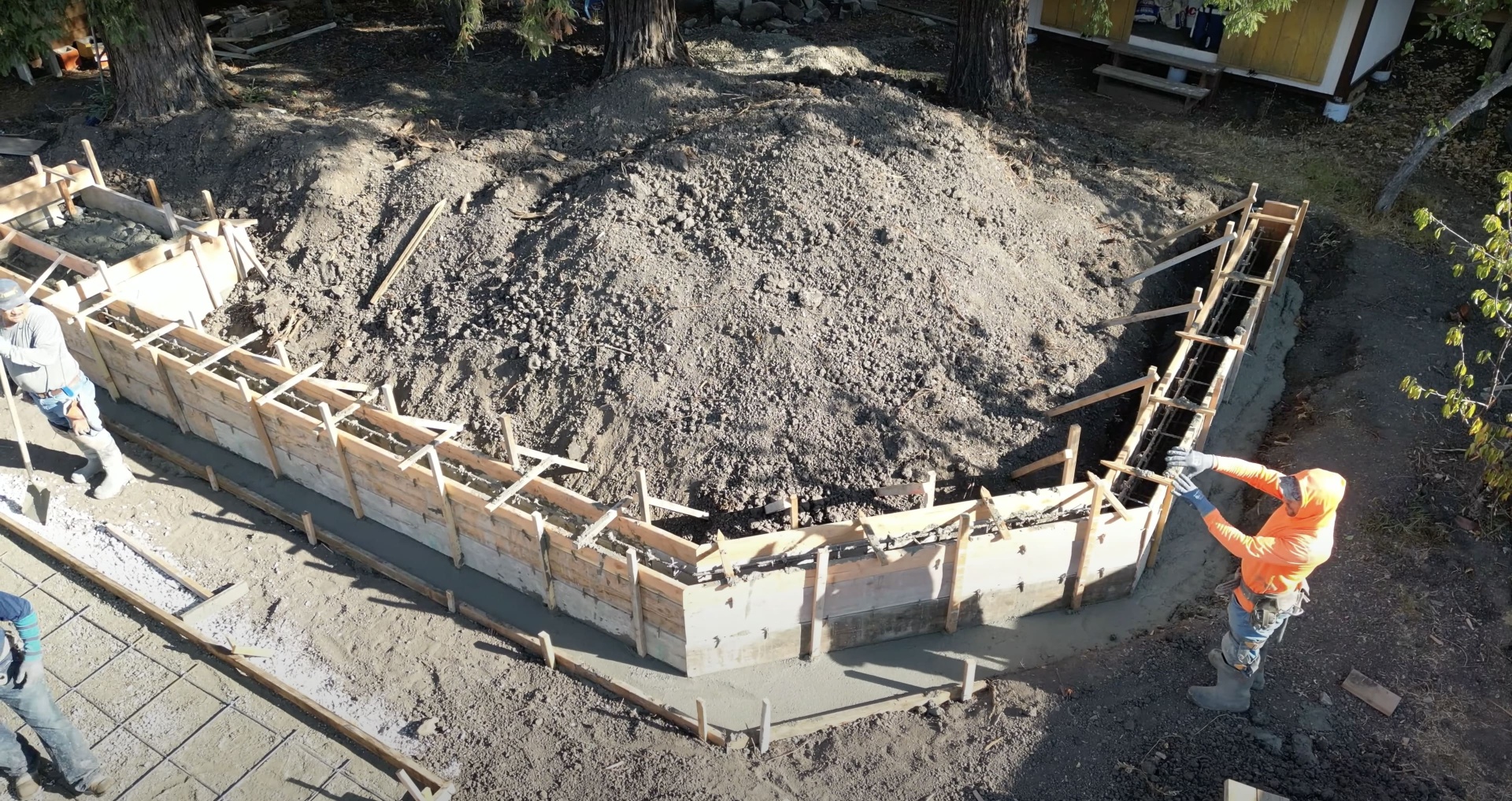 Concrete foundation preparation and formwork setup for residential construction