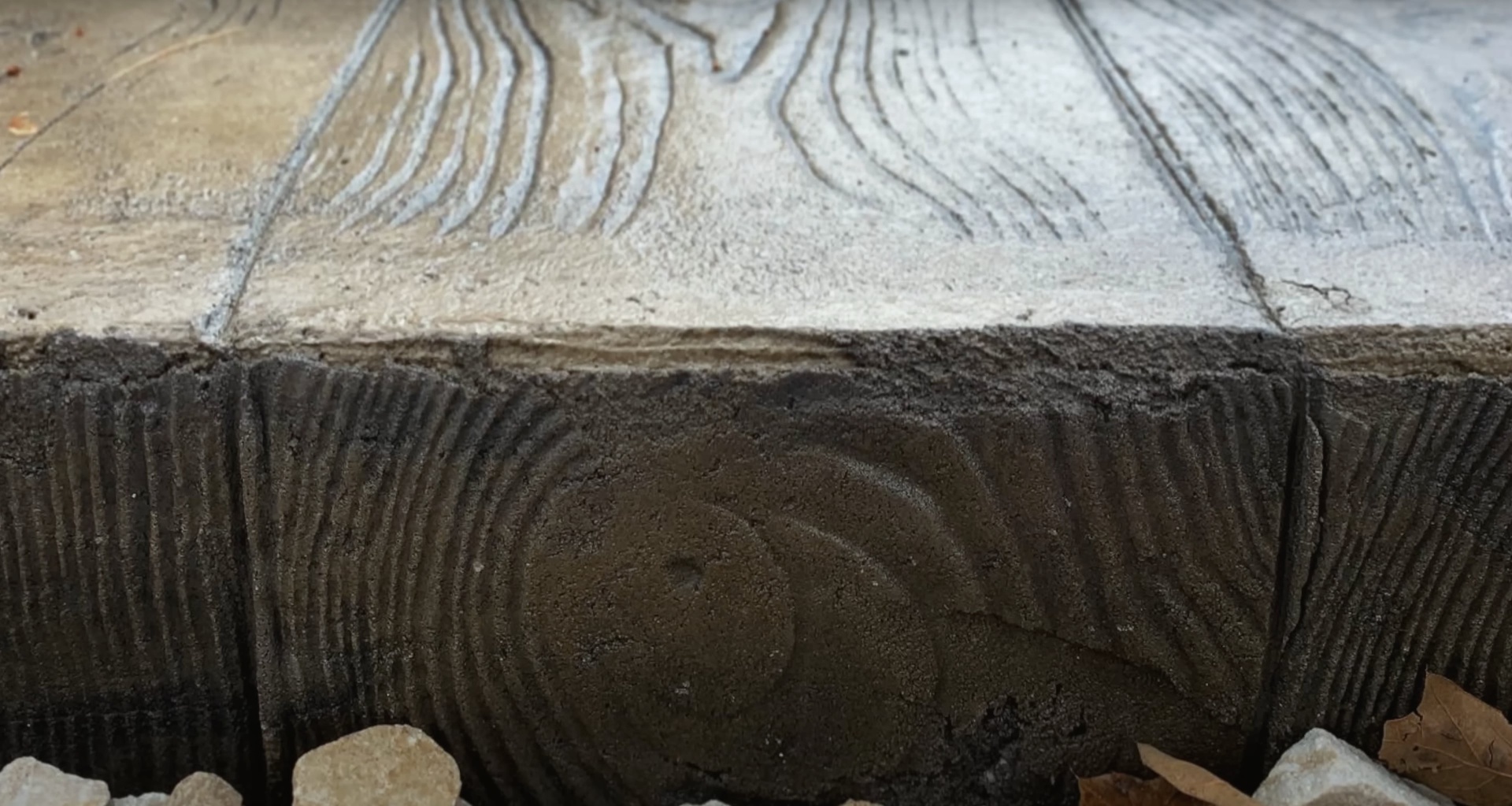 Concrete foundation edge showing professional concrete finishing and texturing work
