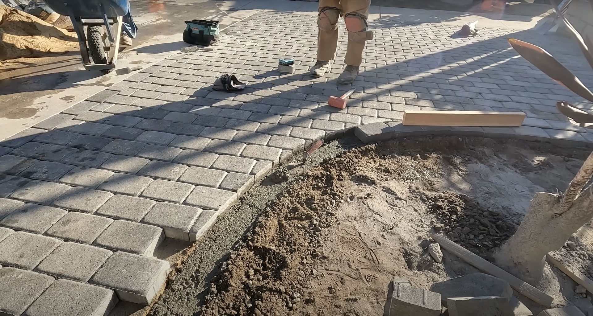 Concrete paver installation in progress showing professional construction process